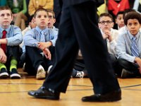 Students are mesmerized as they listen to Steve Pemberton, a biracial foster child from New Bedford, who survived a horrendous upbringing to go on to become a Fortune 500 executive with Walgreens, share his story with boys at the Nativity Prep School in New Bedford on May 5, 2016.